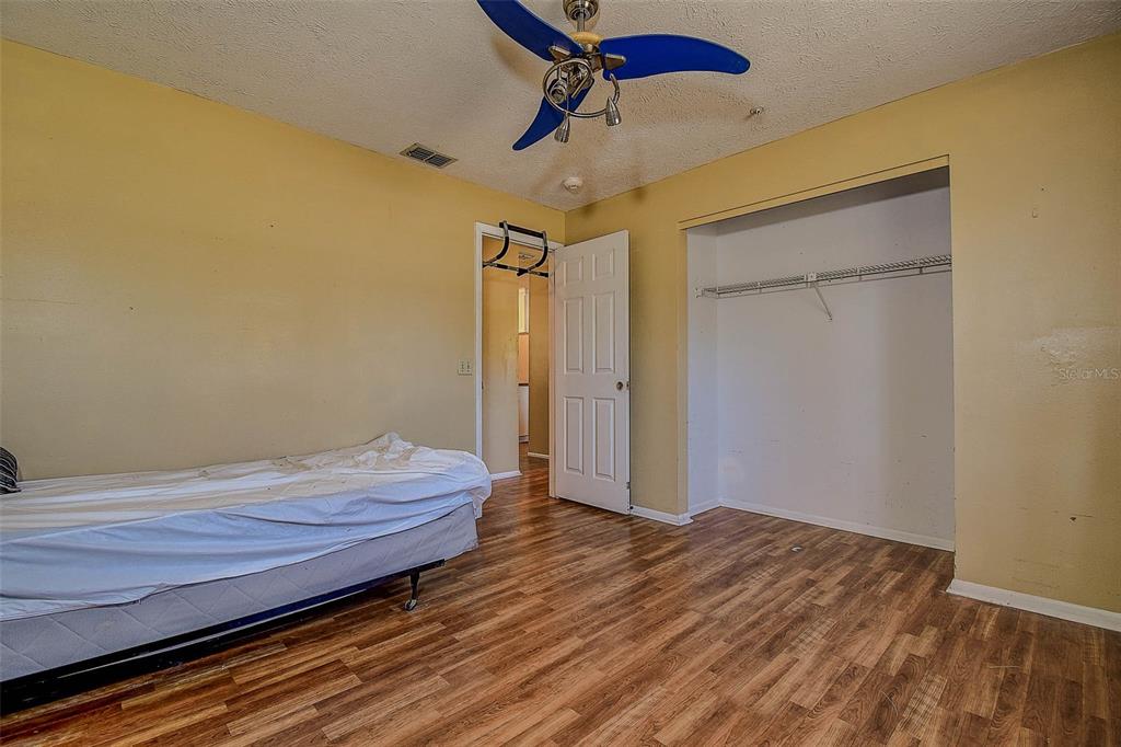 11425 Sun Road Dade City, FL 33525 - Photo 18 of 41 a view of room with wooden floor
