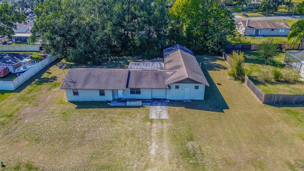 11425 Sun Road Dade City, FL 33525 - Photo 2 of 41 a view of a swimming pool with a patio