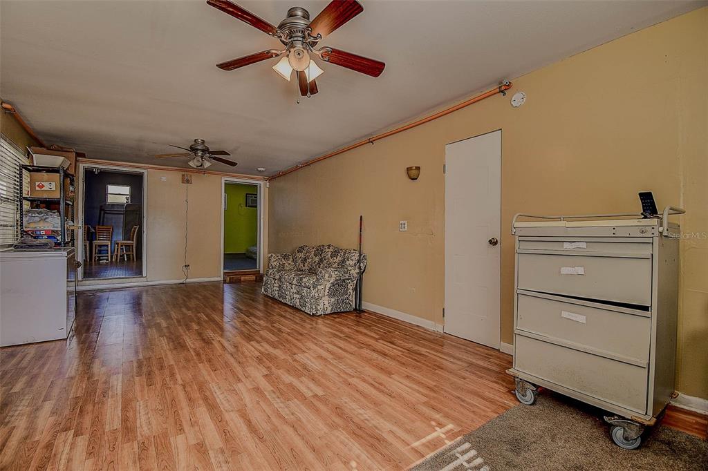 11425 Sun Road Dade City, FL 33525 - Photo 23 of 41 a room with furniture and a ceiling fan