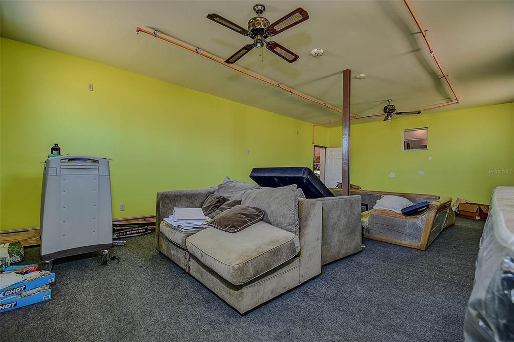 11425 Sun Road Dade City, FL 33525 - Photo 25 of 41 a living room with furniture and a window