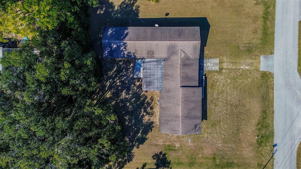 11425 Sun Road Dade City, FL 33525 - Photo 3 of 41 a brick building with a yard