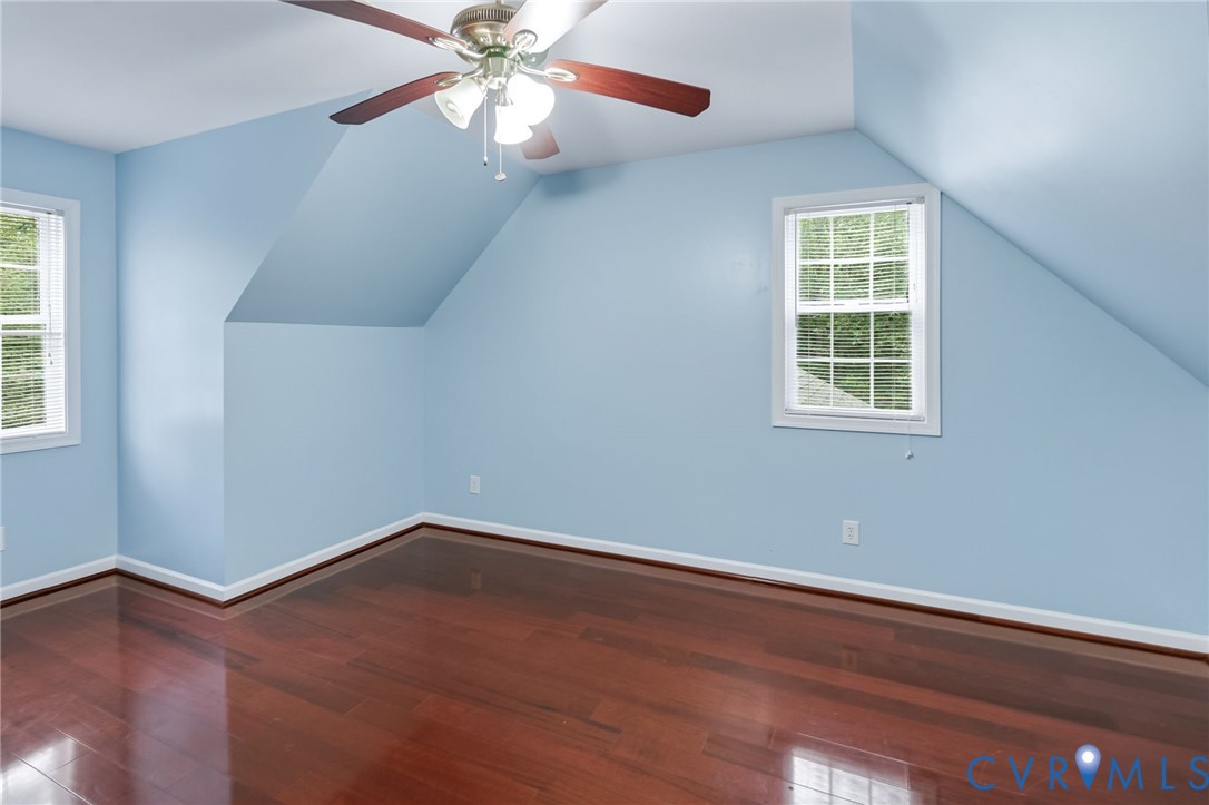 2869 Newville Road Disputanta, VA 23842 - Photo 20 of 26 Rich wood-finish flooring, two windows, and a ceil