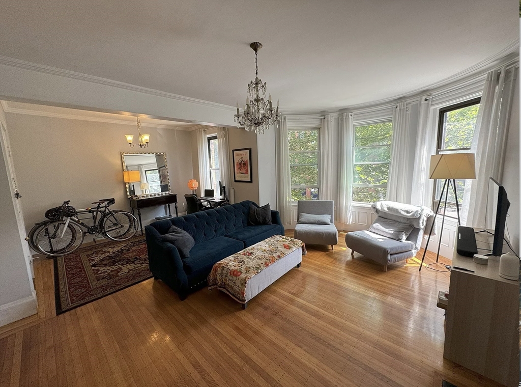 429 Marlborough Street, Unit 3A Boston, MA 02115 - Photo 1 of 21 a living room with furniture and a large window