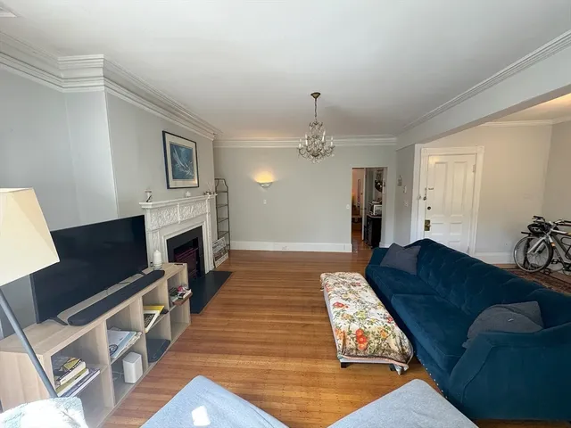 a living room with furniture fireplace and flat screen tv