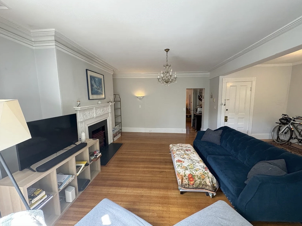 429 Marlborough Street, Unit 3A Boston, MA 02115 - Photo 15 of 21 a living room with furniture fireplace and flat screen tv