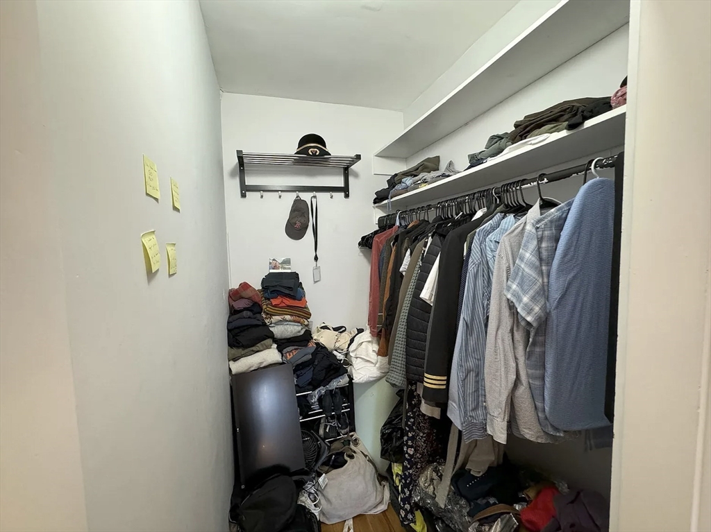 429 Marlborough Street, Unit 3A Boston, MA 02115 - Photo 16 of 21 a view of walk in closet with clothes and shoes