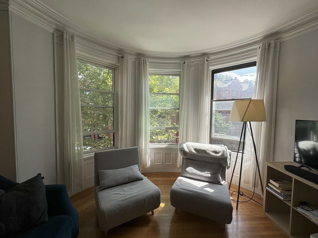 429 Marlborough Street, Unit 3A Boston, MA 02115 - Photo 19 of 21 a living room with furniture and a window