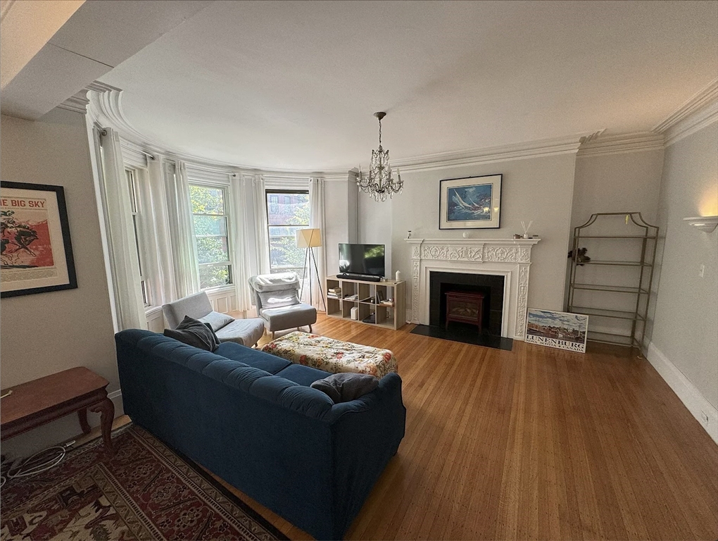 429 Marlborough Street, Unit 3A Boston, MA 02115 - Photo 2 of 21 a living room with furniture and a fireplace
