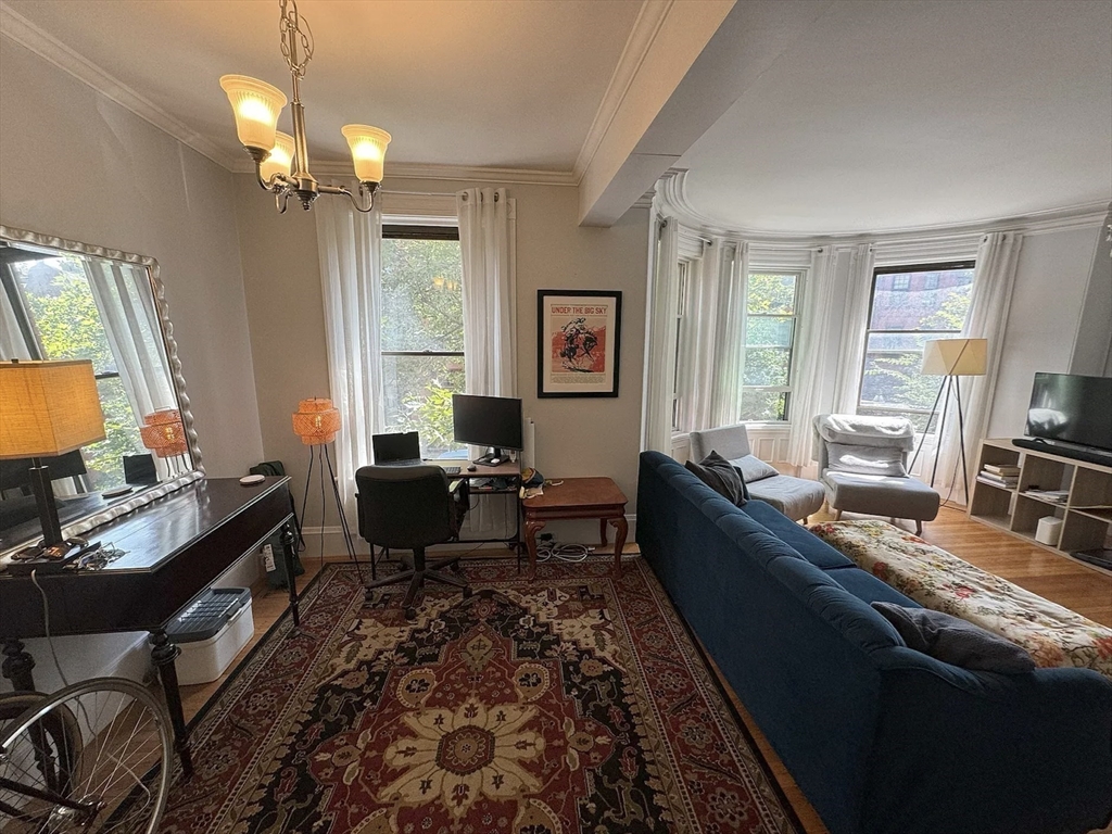 429 Marlborough Street, Unit 3A Boston, MA 02115 - Photo 3 of 21 a living room with furniture and a flat screen tv