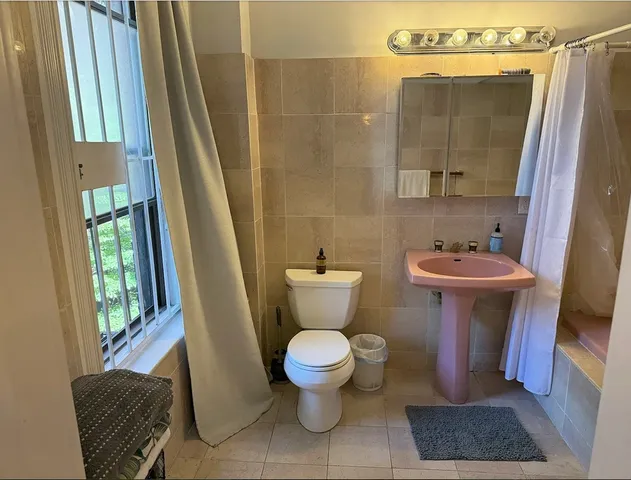 a bathroom with a toilet and a sink