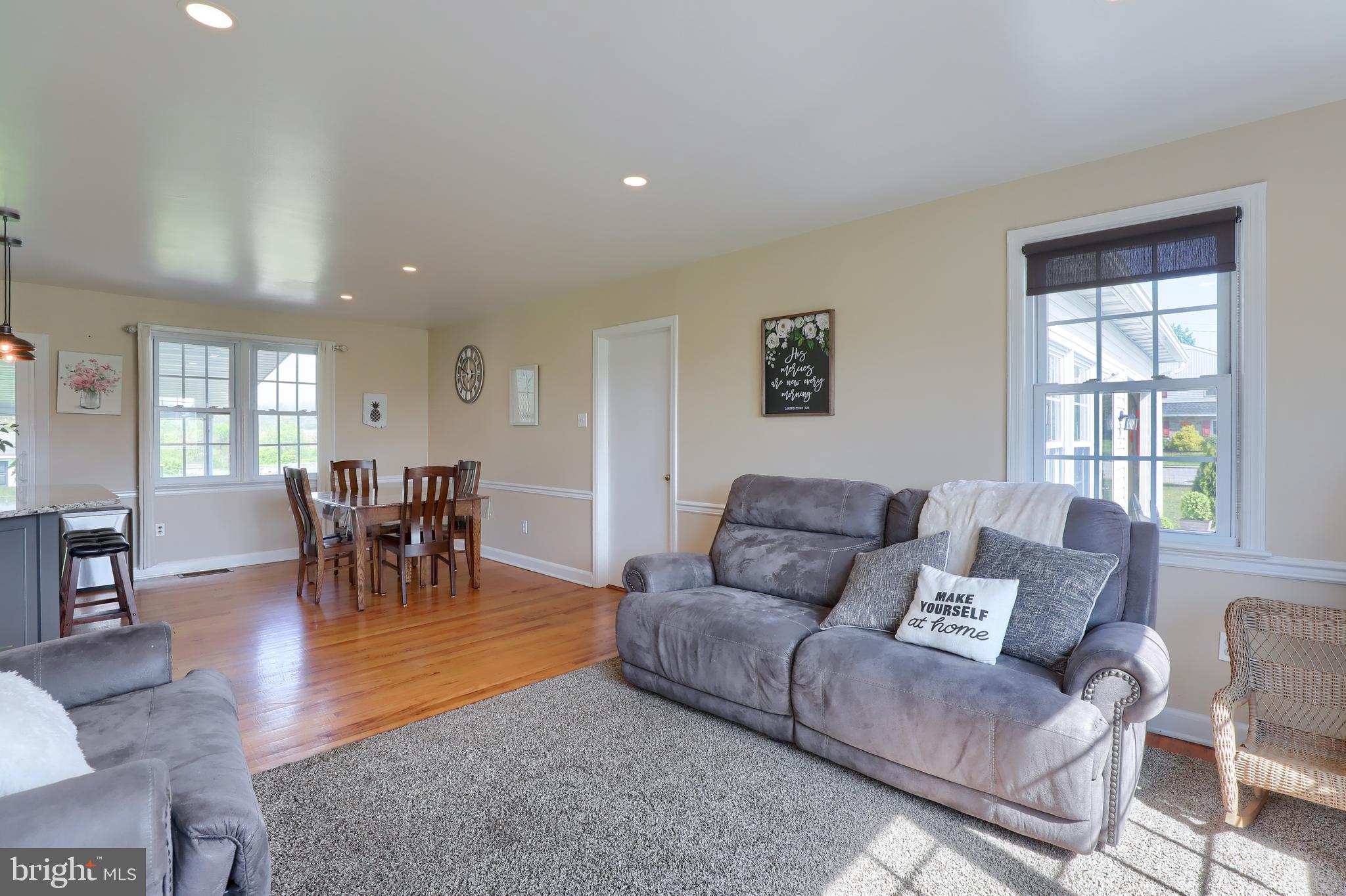 1913 Mine Road Paradise, PA 17562 - Photo 16 of 53 a living room with furniture and a dining table with kitchen view