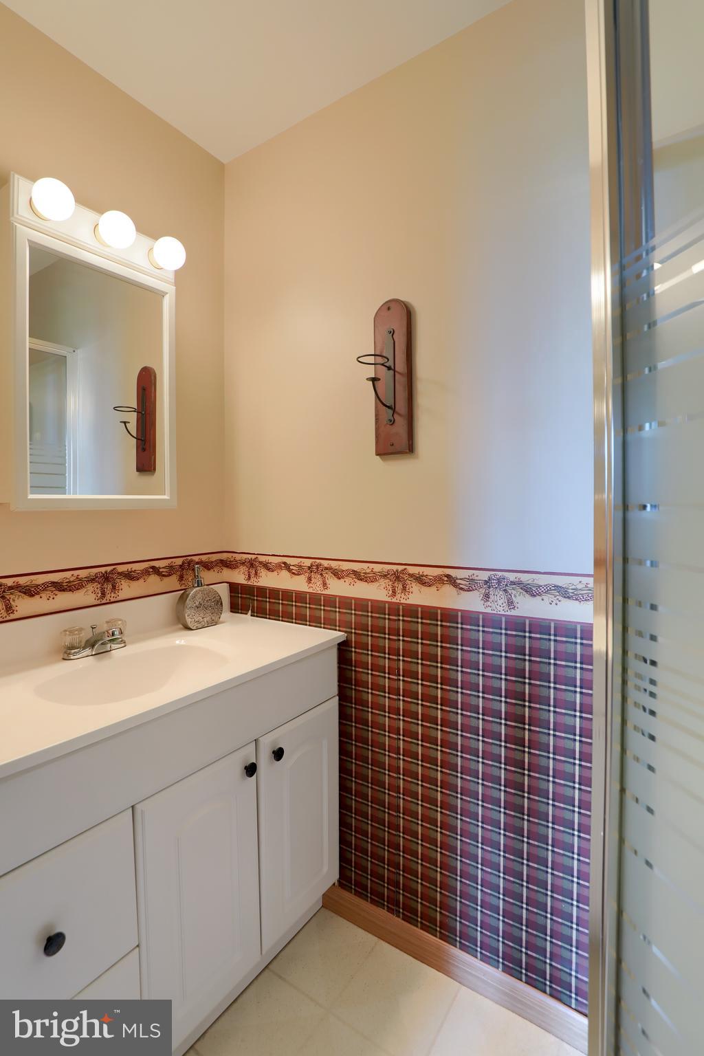 1913 Mine Road Paradise, PA 17562 - Photo 20 of 53 a bathroom with a sink and a mirror