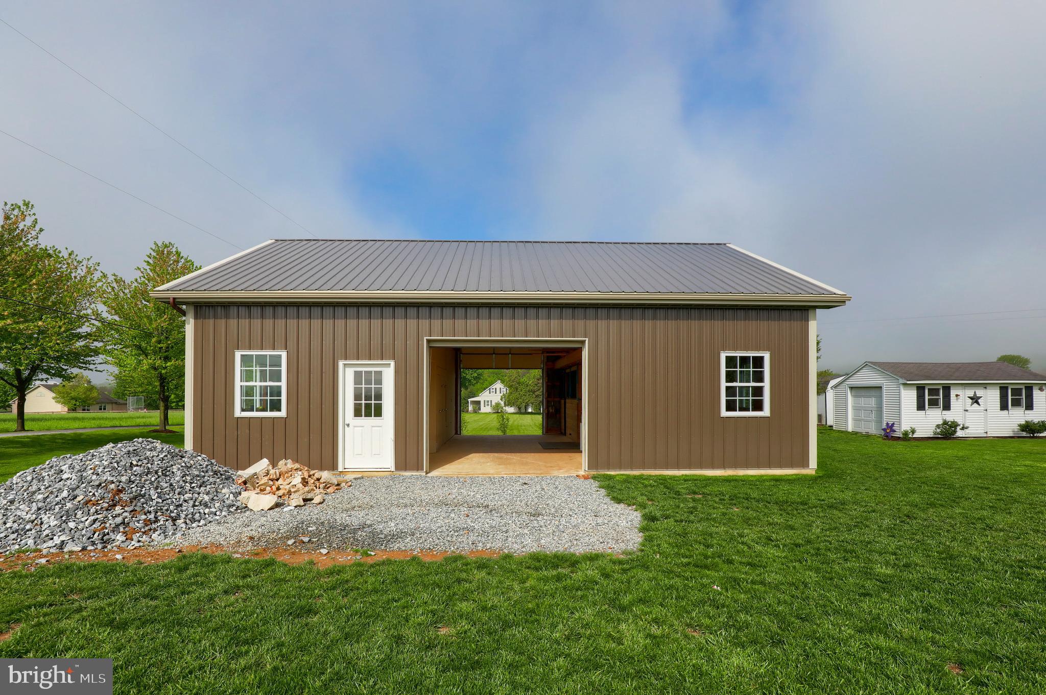 1913 Mine Road Paradise, PA 17562 - Photo 45 of 53 a front view of a house with a yard and garage