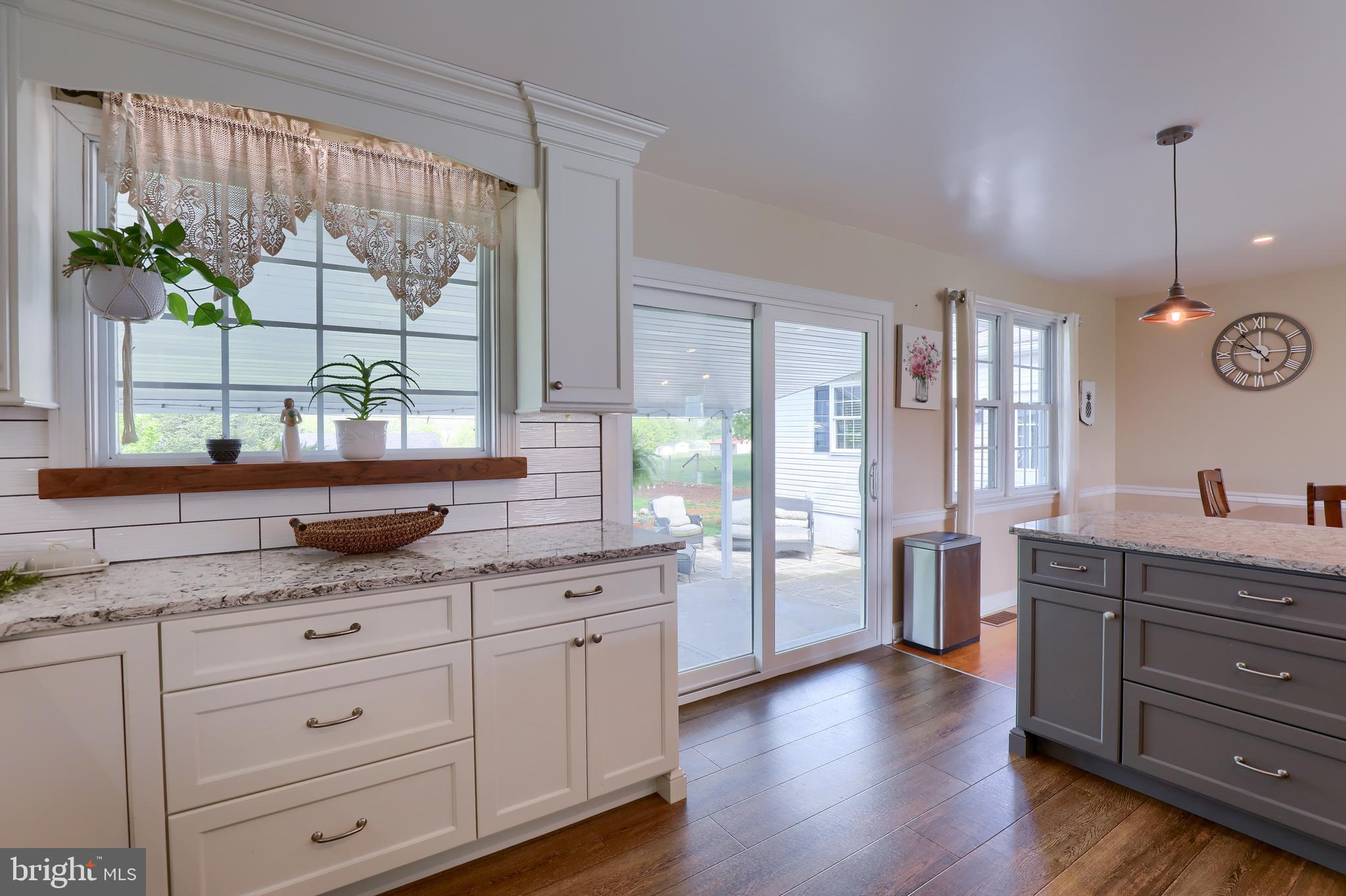 1913 Mine Road Paradise, PA 17562 - Photo 8 of 53 a kitchen with granite countertop a stove a sink and a window