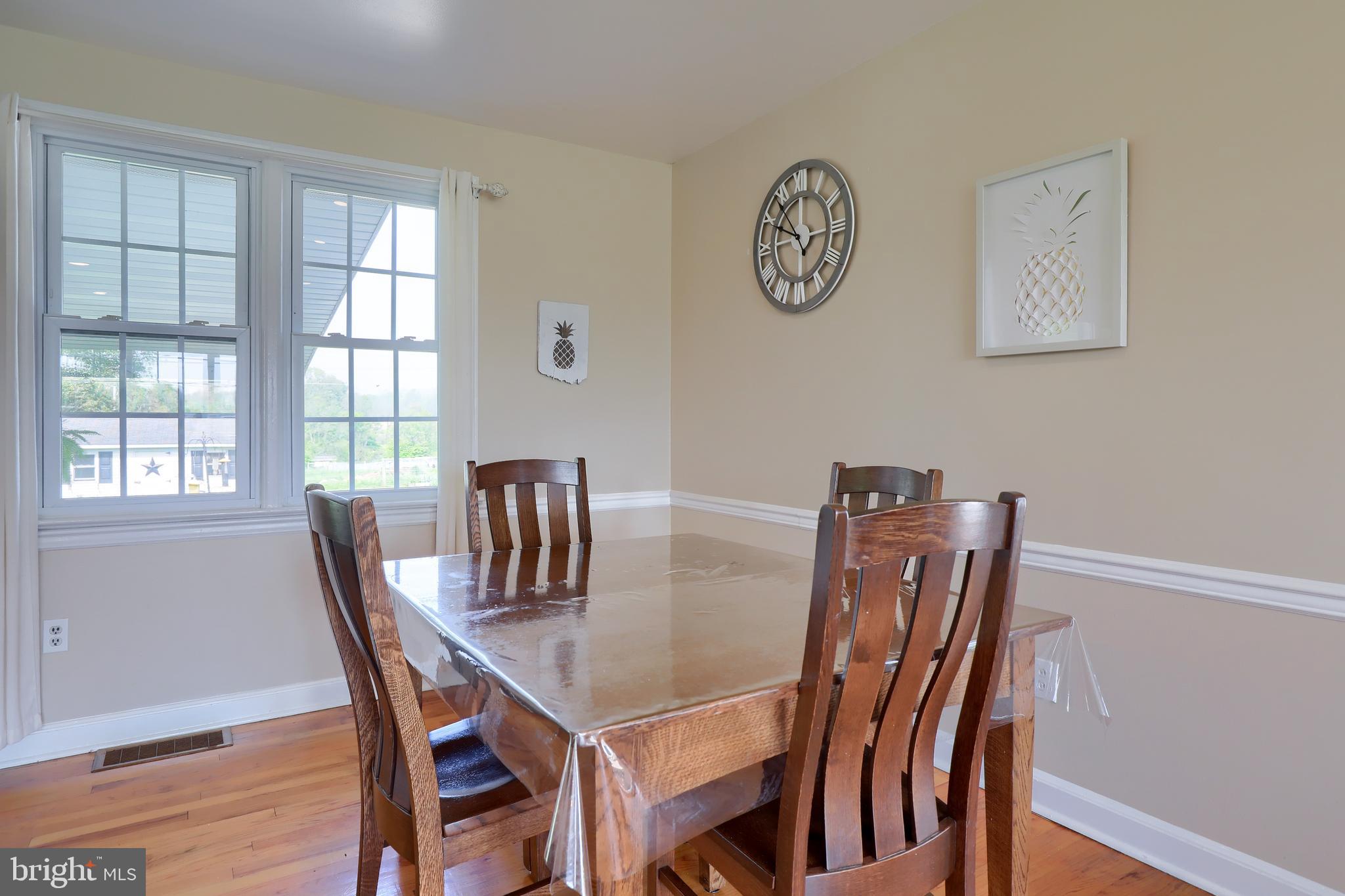 1913 Mine Road Paradise, PA 17562 - Photo 10 of 53 a view of a dining room with furniture window and wooden floor