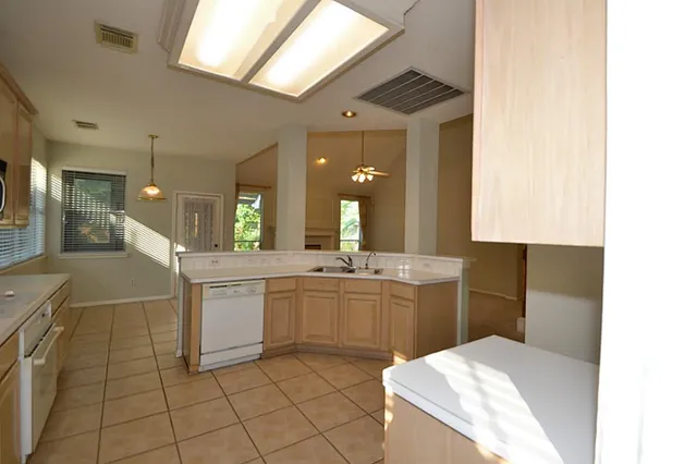 a view of a kitchen with a sink