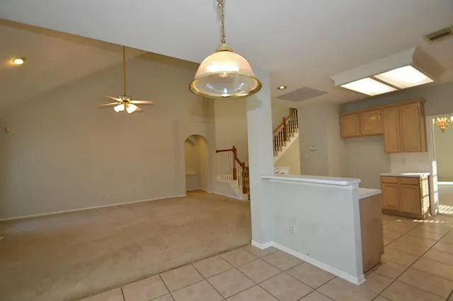 a kitchen with a sink appliances and cabinets