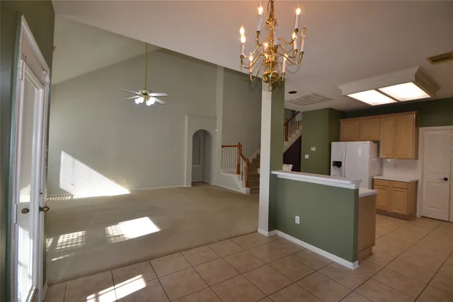 a kitchen with a stove a sink and a refrigerator