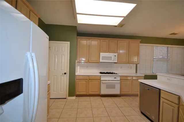 a view of a hallway with chandelier