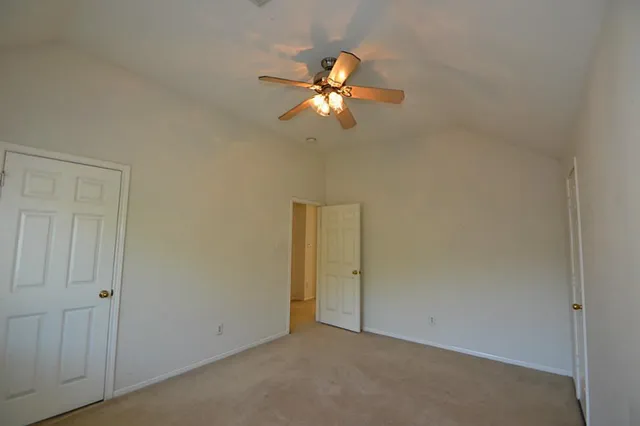 a view of a kitchen with a sink and chandelier