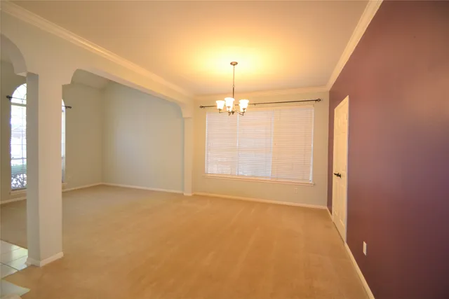 a kitchen with stainless steel appliances granite countertop a sink a stove top oven and cabinets