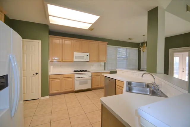 a view of a kitchen and a windows