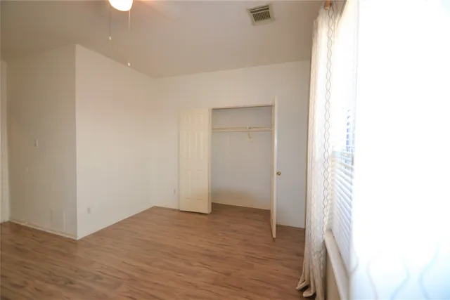 a kitchen with a sink appliances and cabinets