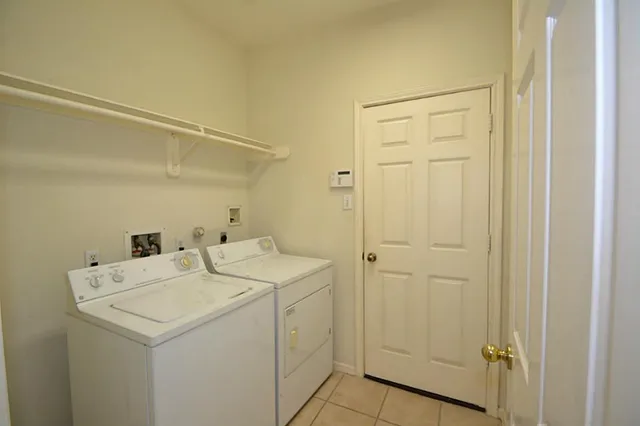 a kitchen with a sink appliances and cabinets