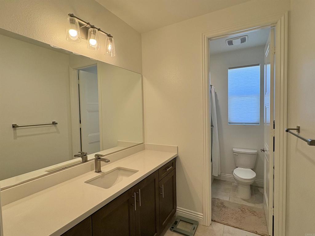 39529 Dayspring Way Temecula, CA 92591 - Photo 31 of 49 a bathroom with a sink a toilet and shower