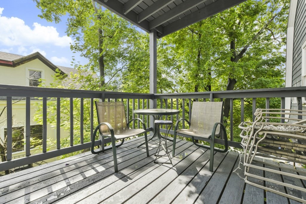 7 Cummings Road, Unit 7 Boston, MA 02135 - Photo 9 of 19 a view of a balcony with chairs and wooden floor