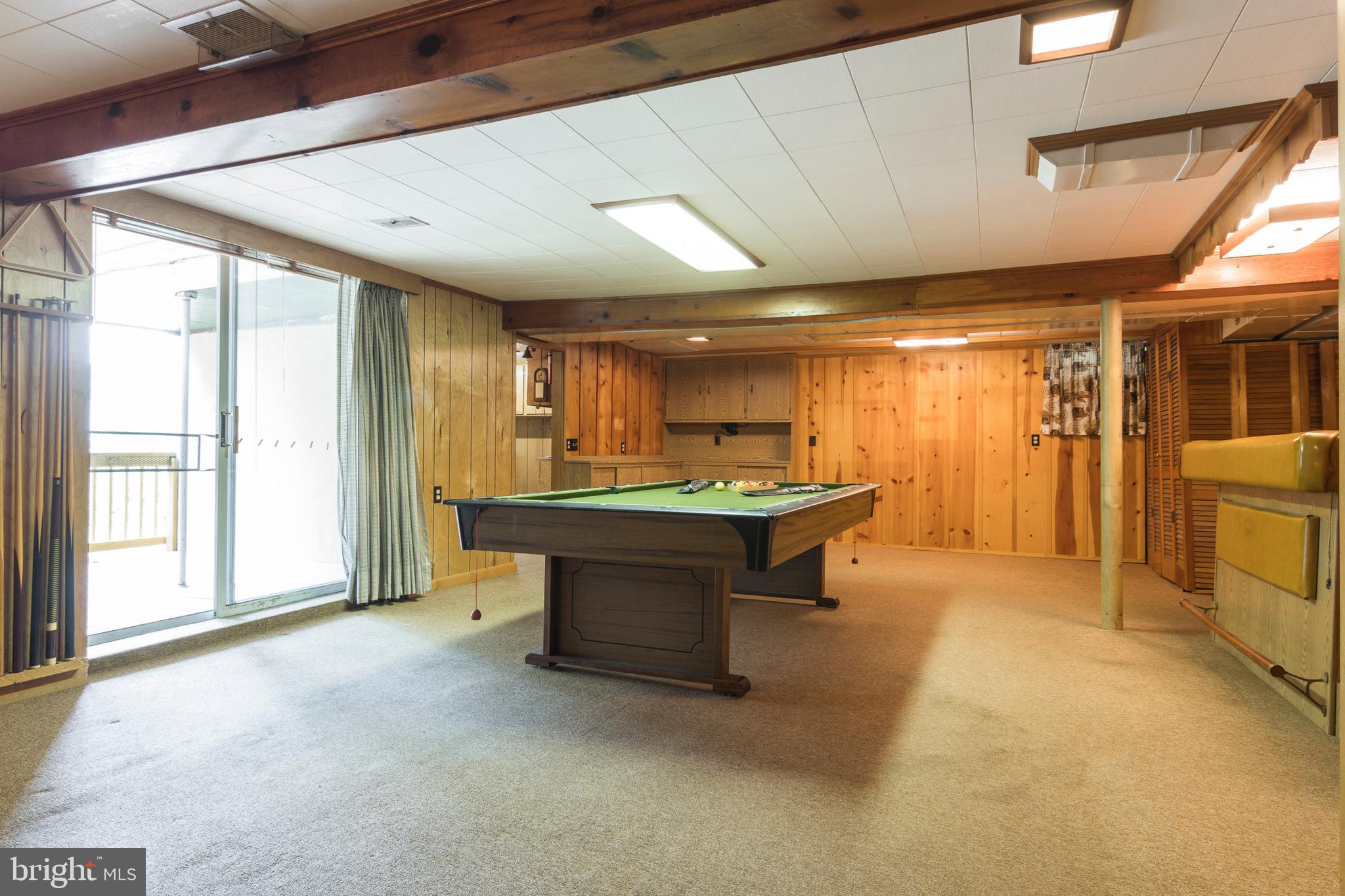 409 Waveland Road Baltimore, MD 21228 - Photo 27 of 38 Huge recreation room with sliders to deck