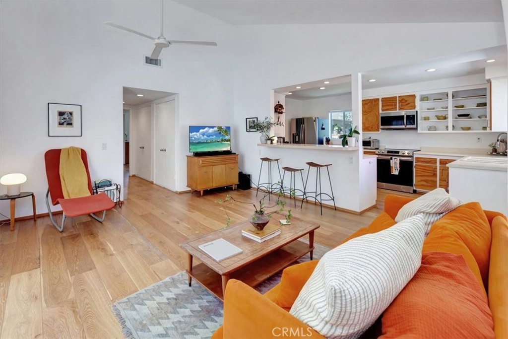 5821 Sierra Cielo Road Irvine, CA 92603 - Photo 11 of 26 a living room with furniture and wooden floor