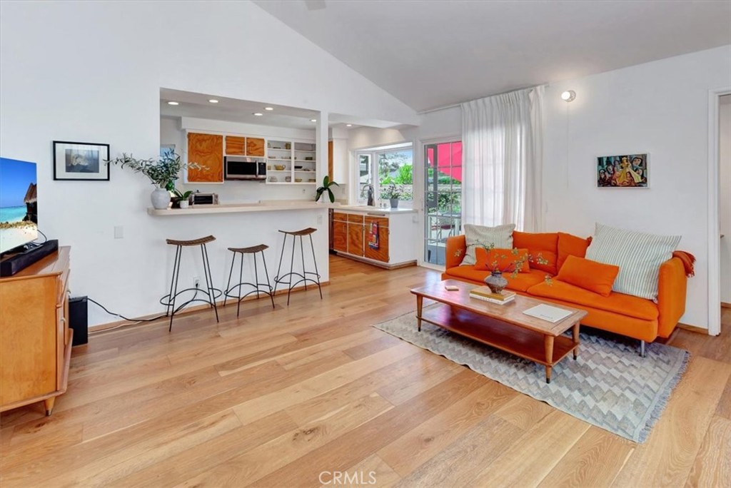 5821 Sierra Cielo Road Irvine, CA 92603 - Photo 12 of 26 a living room with furniture and a flat screen tv