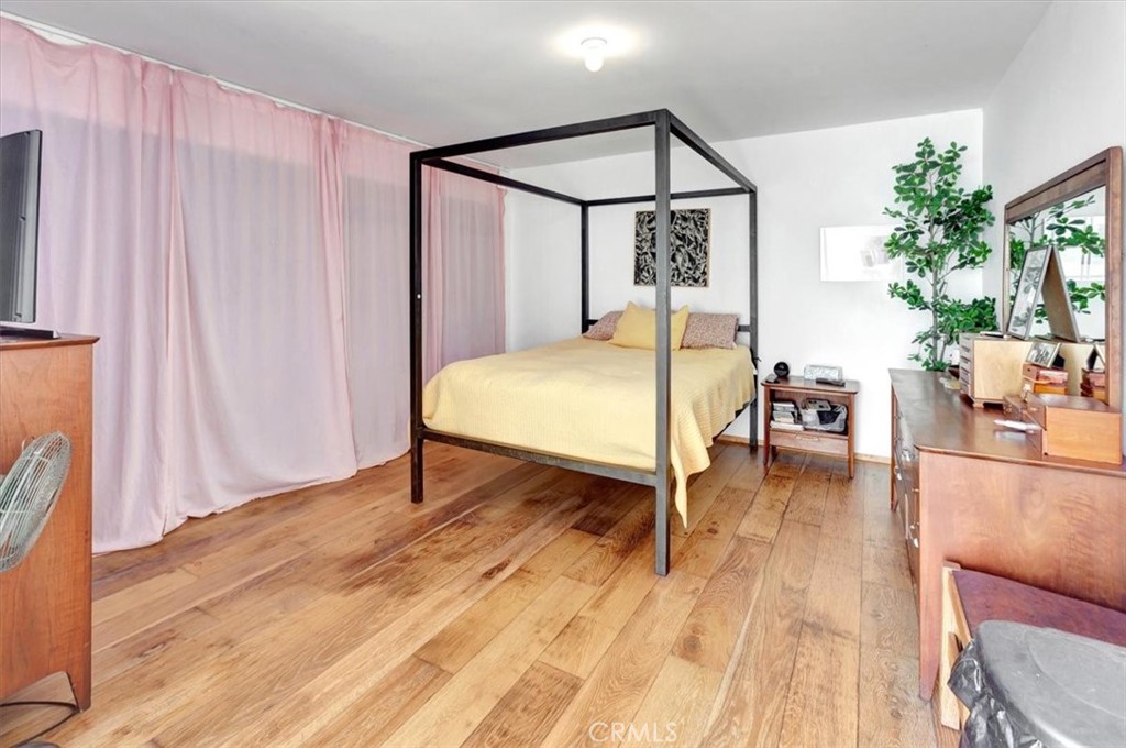 5821 Sierra Cielo Road Irvine, CA 92603 - Photo 15 of 26 a dining room with wooden floor and windows