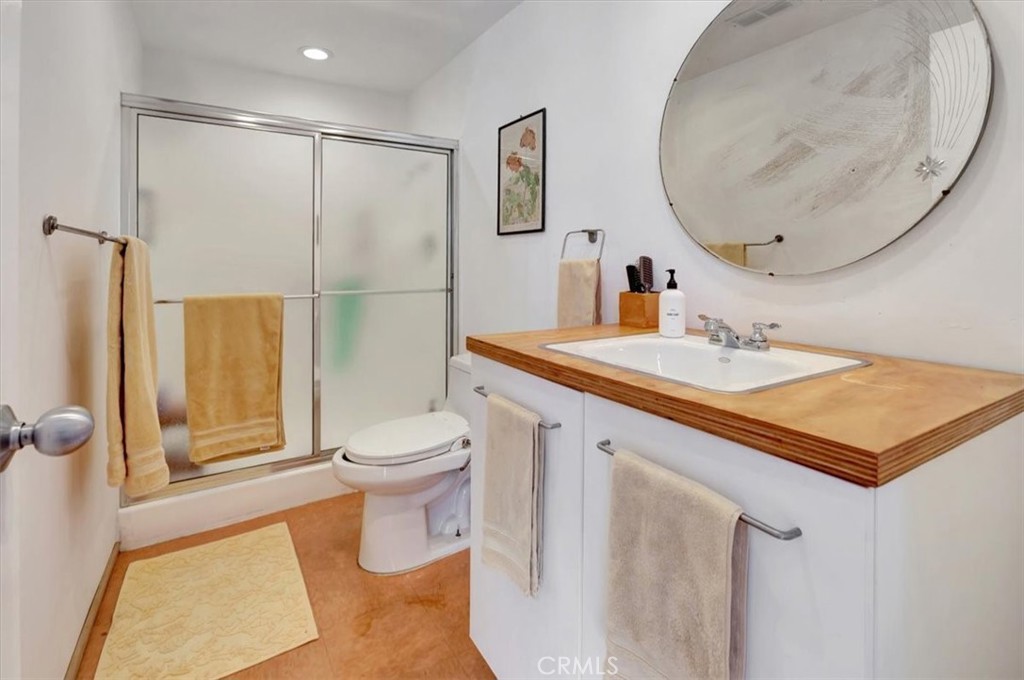 5821 Sierra Cielo Road Irvine, CA 92603 - Photo 16 of 26 a bathroom with a sink a toilet and shower