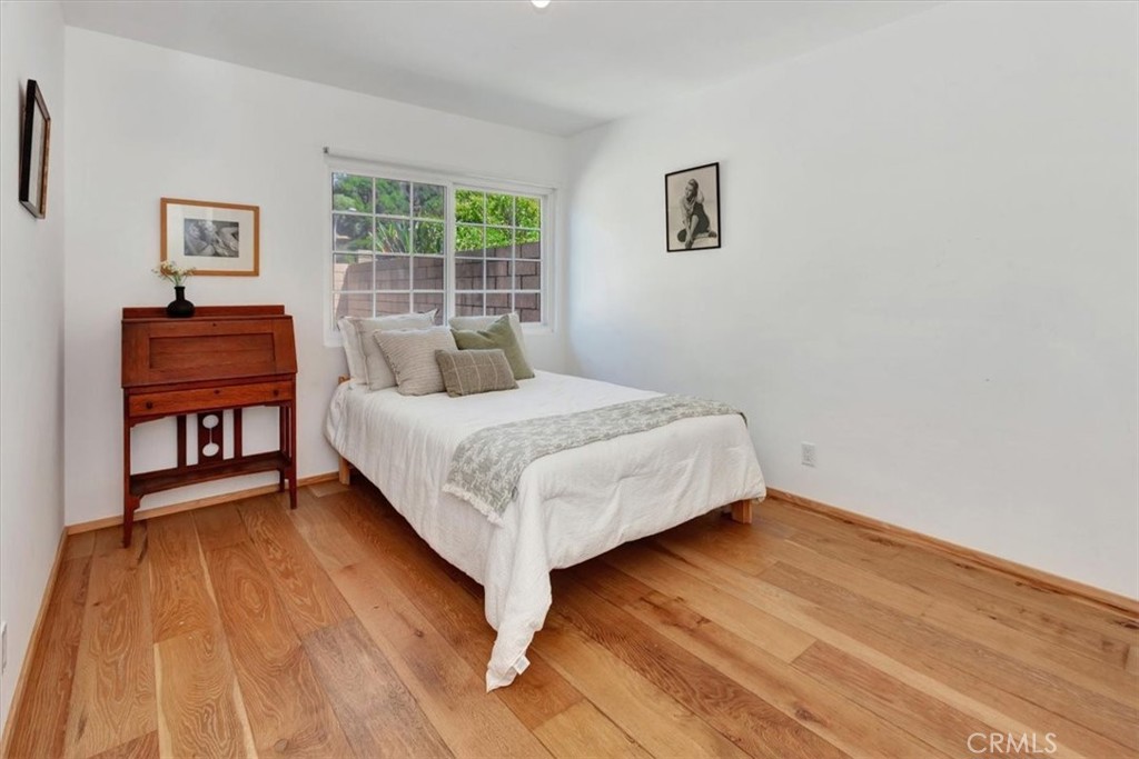 5821 Sierra Cielo Road Irvine, CA 92603 - Photo 17 of 26 a bedroom with a bed and a table