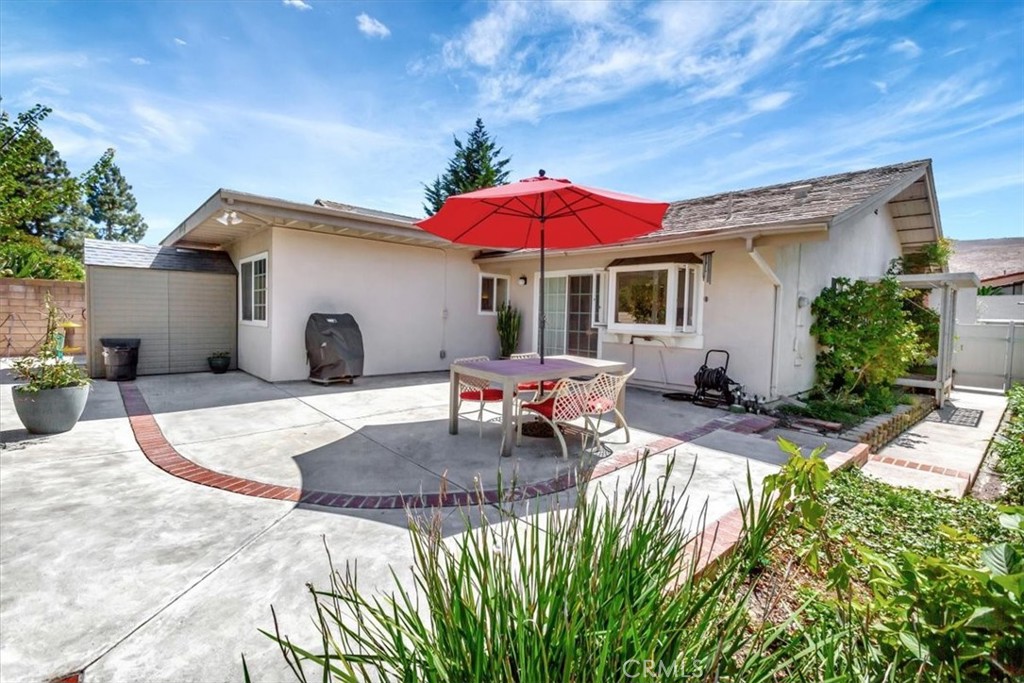 5821 Sierra Cielo Road Irvine, CA 92603 - Photo 3 of 26 a view of a house with backyard porch and sitting area