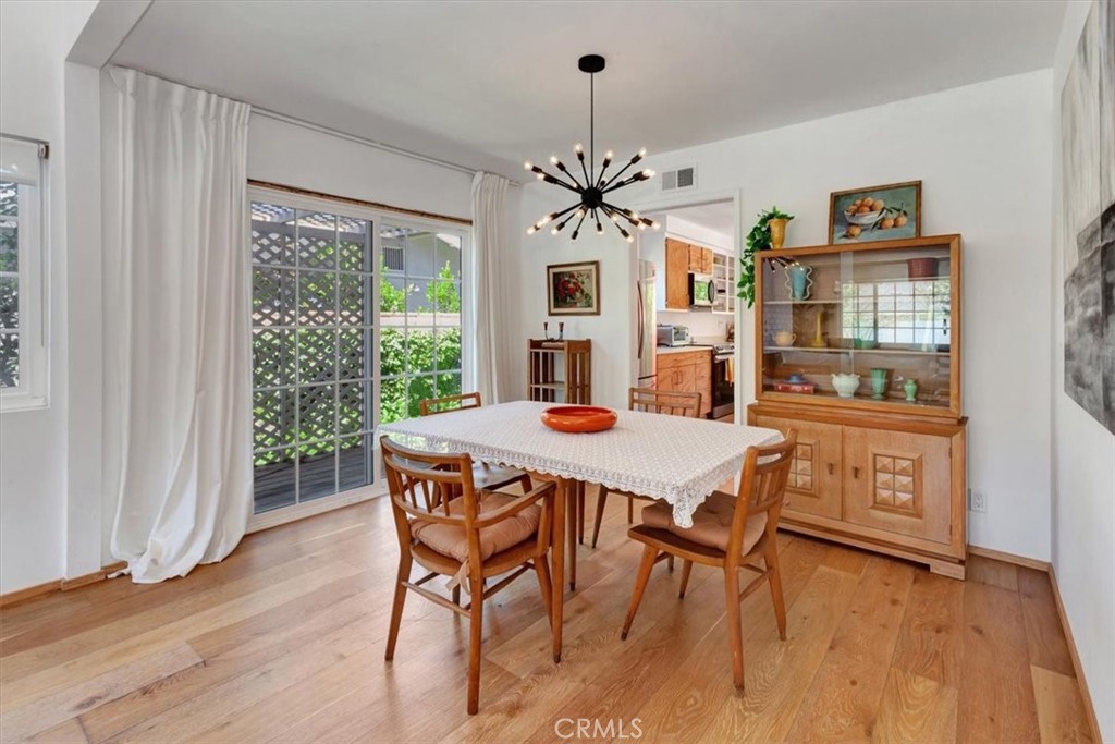 5821 Sierra Cielo Road Irvine, CA 92603 - Photo 9 of 26 a view of a dining room with furniture window and wooden floor