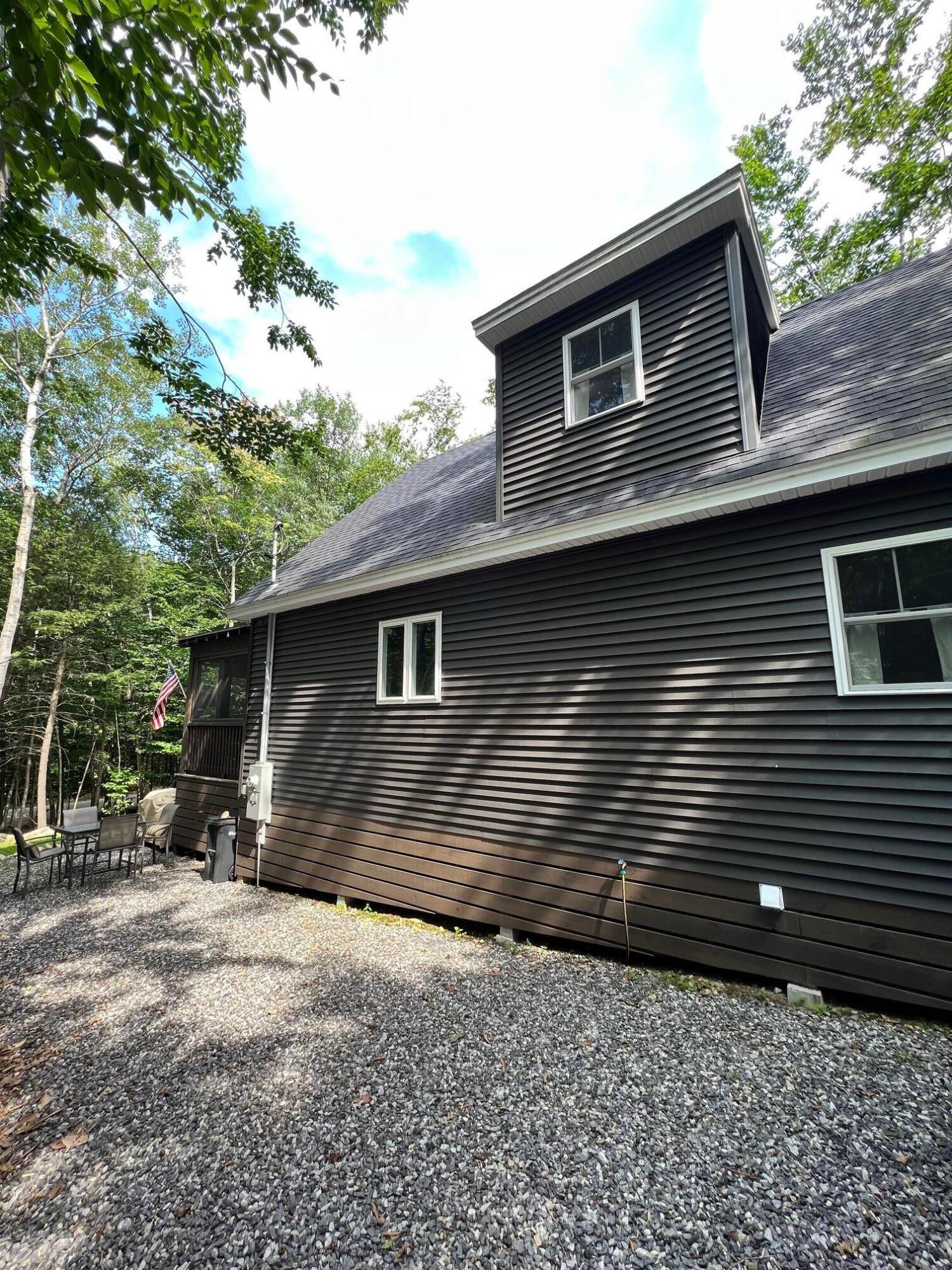 63 Ridge Road Frye Island, ME 04084 - Photo 2 of 29 Side of House