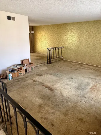 a view of kitchen and empty room