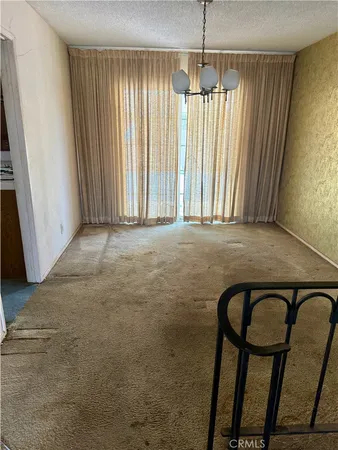 a view of a room with windows and stairs
