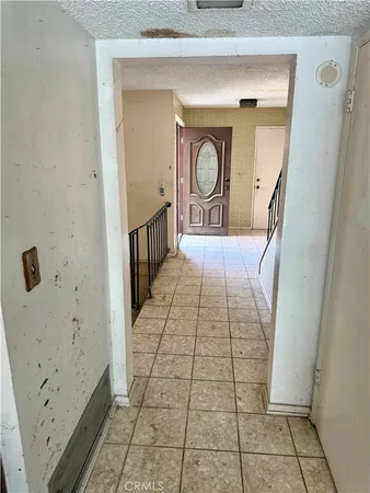 a view of a hallway view with wooden floor and staircase