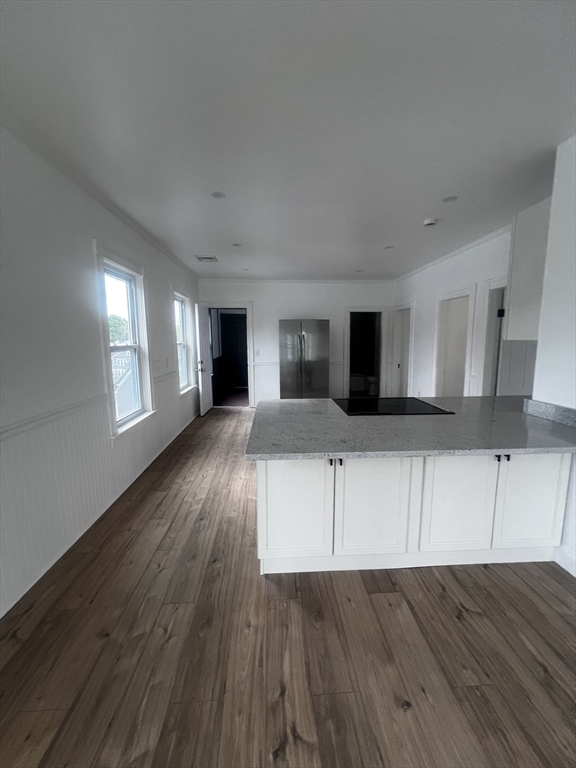 19 Reeves Street Worcester, MA 01607 - Photo 15 of 30 a view of a living room hardwood floor and a kitchen