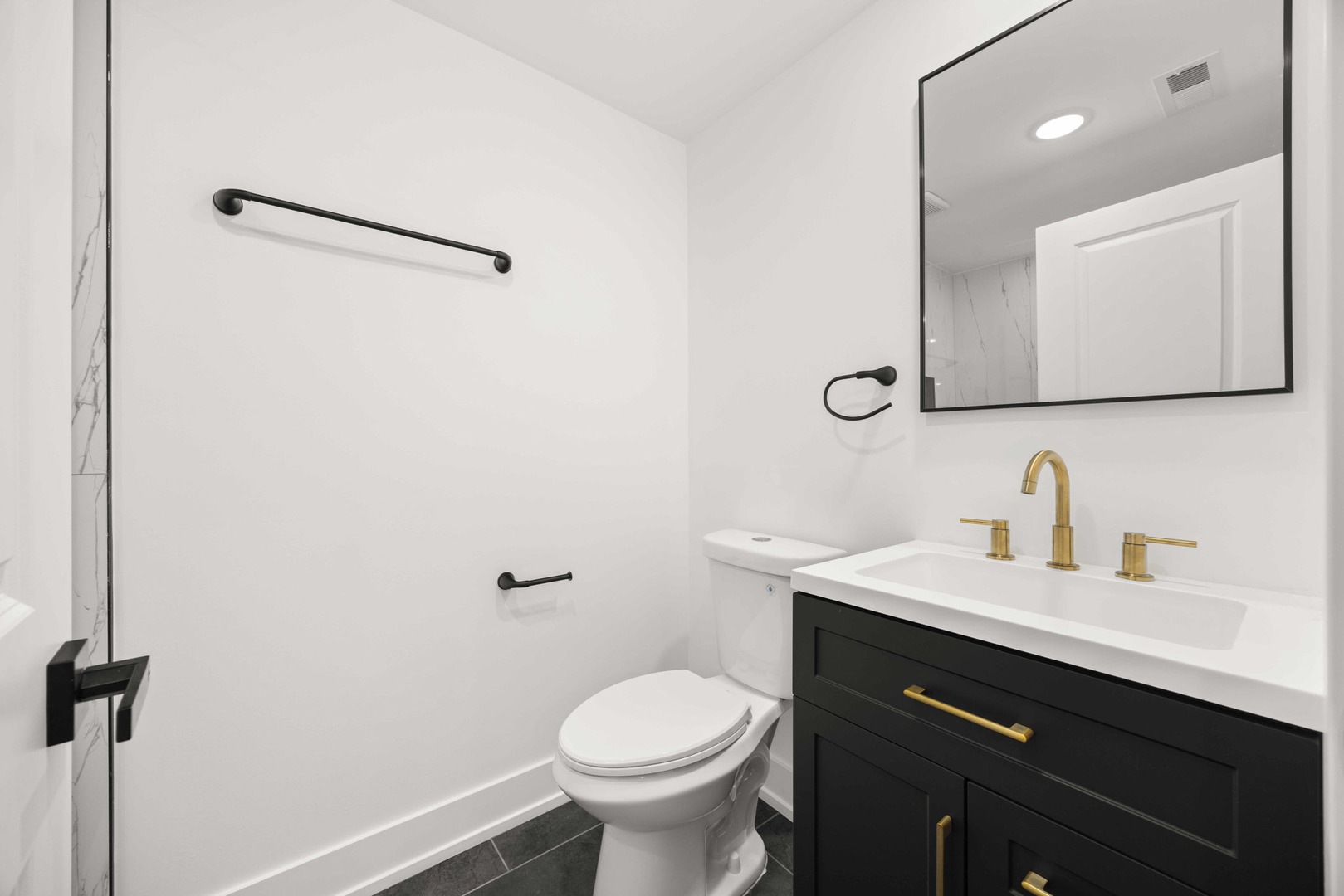 7232 South Union Avenue Chicago, IL 60621 - Photo 9 of 11 a bathroom with a sink toilet and mirror