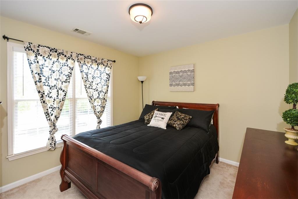 10 Arbor Hills Road South Talking Rock, GA 30175 - Photo 27 of 89 a bedroom with a bed and a window