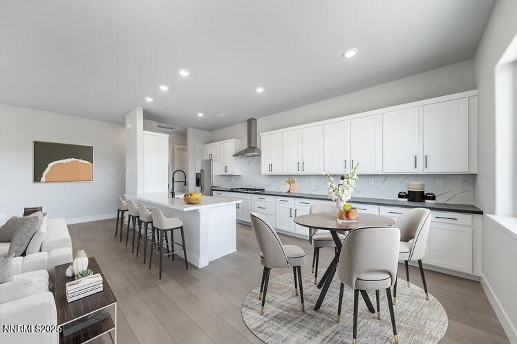 1357 Silver View Circle Sparks, NV 89436 - Photo 11 of 44 a kitchen with a dining table chairs and wooden floor