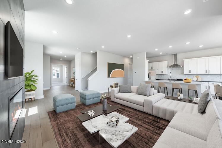 1357 Silver View Circle Sparks, NV 89436 - Photo 13 of 44 a living room with furniture kitchen view and a chandelier