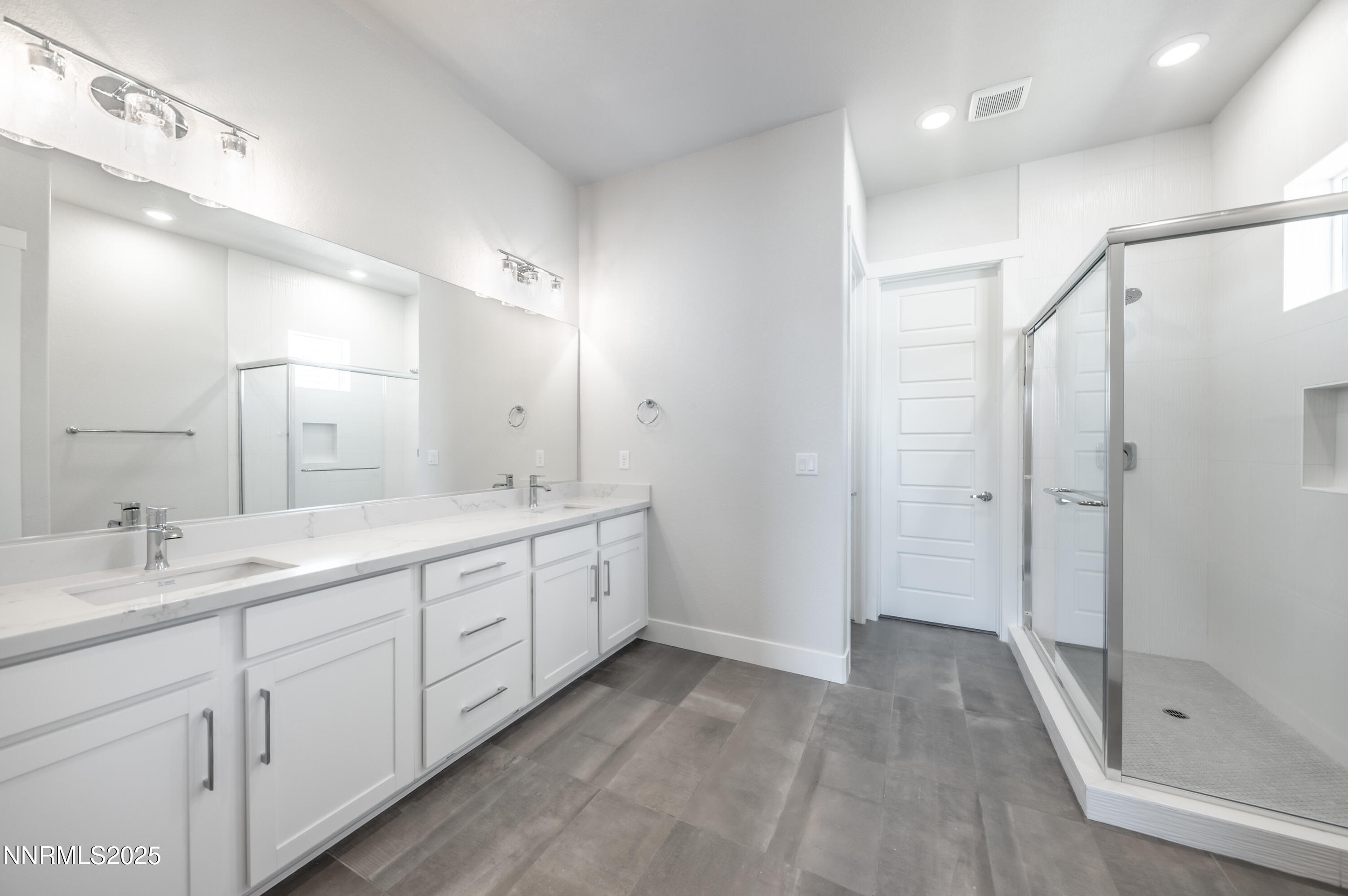 1357 Silver View Circle Sparks, NV 89436 - Photo 21 of 44 a spacious bathroom with a double vanity sink mirror double and shower