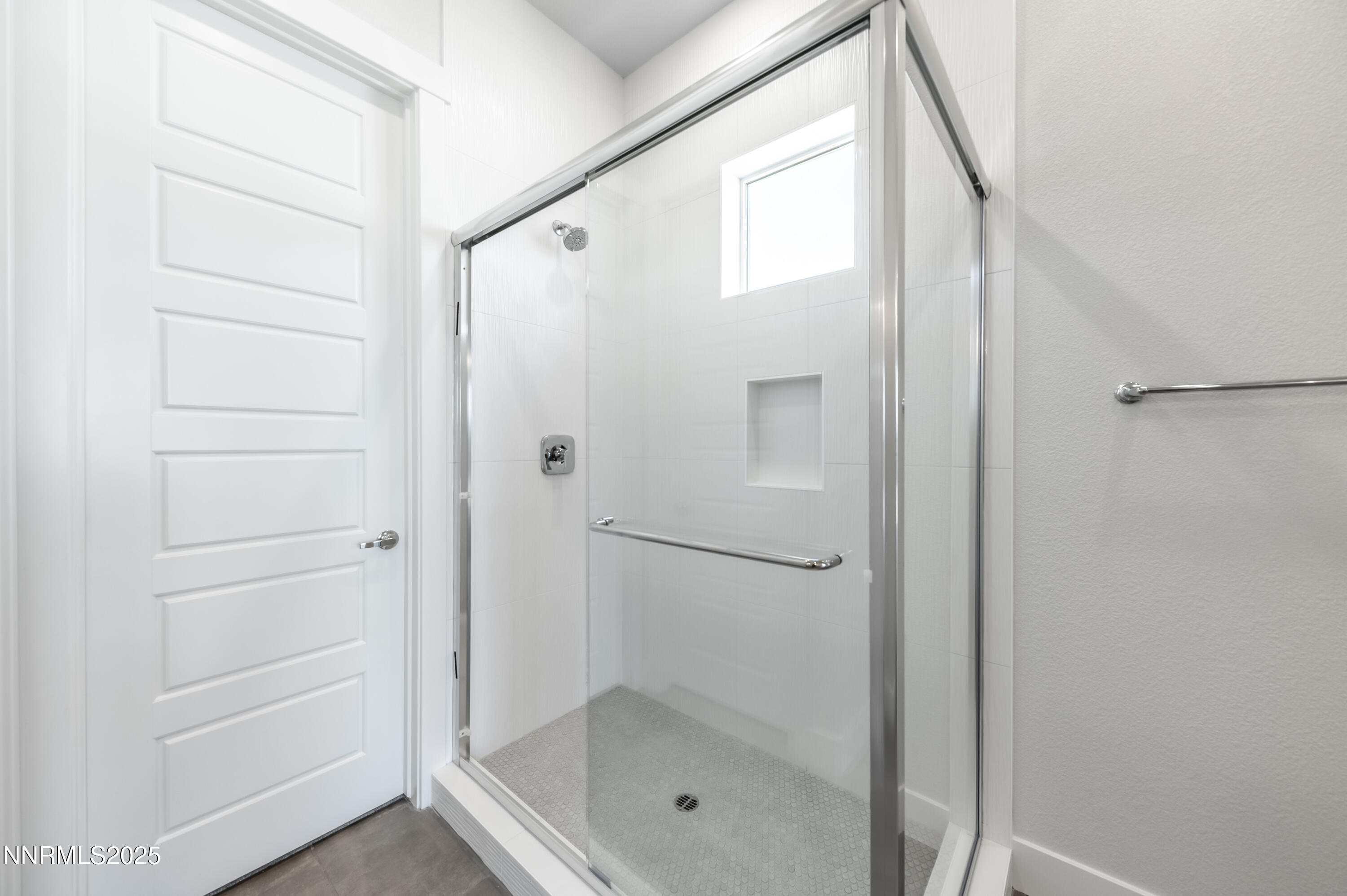 1357 Silver View Circle Sparks, NV 89436 - Photo 22 of 44 a bathroom with a glass shower door