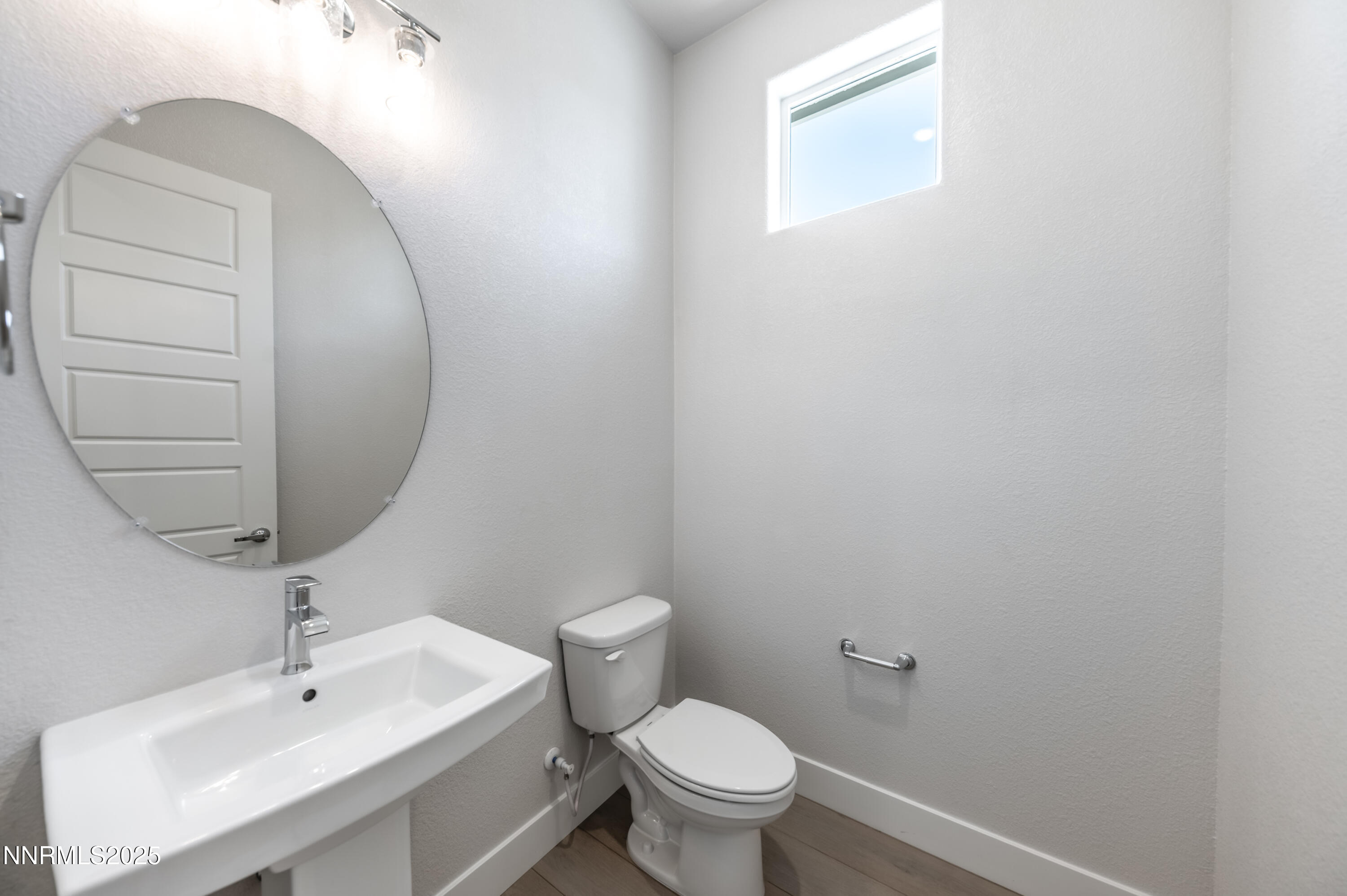 1357 Silver View Circle Sparks, NV 89436 - Photo 25 of 44 a bathroom with a toilet a sink and mirror